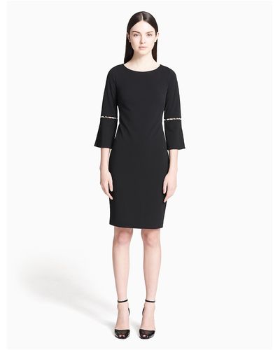 black dress with split sleeves