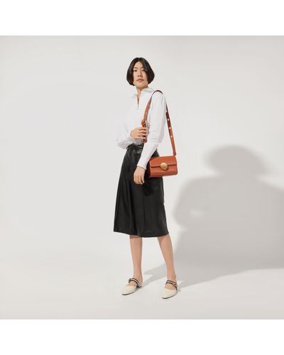 charles and keith orange sling bolsa