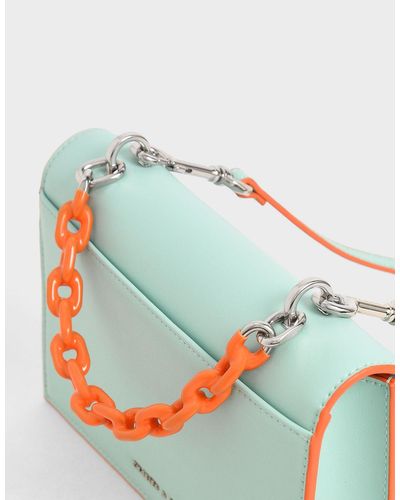 charles and keith two tone chain top handle bag