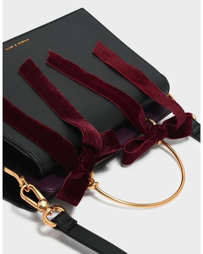 velvet bow detail handbolsa