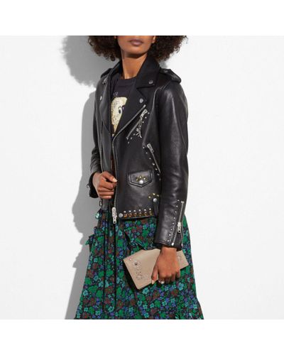 hayden foldover crossbody clutch with floral tooling