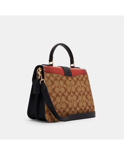 Large georgie forbiciona top handle in colorblock signature canvas with rivets