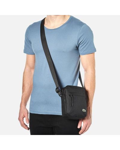 lacoste vertical camera bolsa