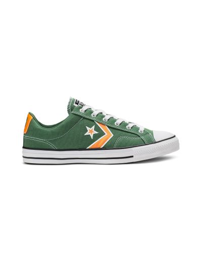 white converse with green stars