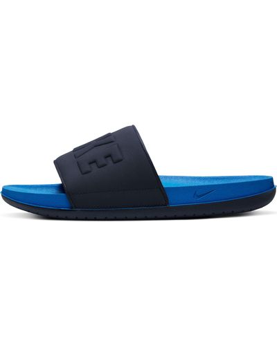 blue and yellow nike slides