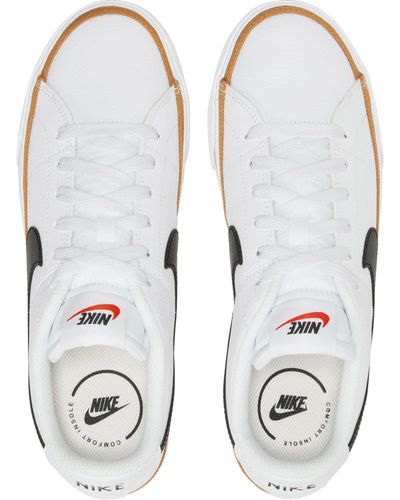 white nike court legacy sneakers womens