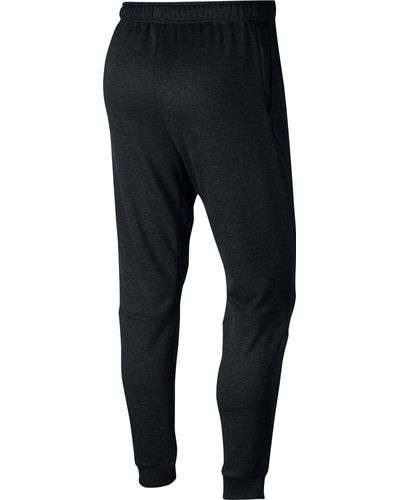nike training tapered fleece pants in black