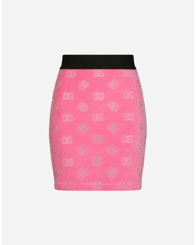 Dolce & Gabbana Flocked Jersey Miniskirt With All-Over Dg Logo - Pink