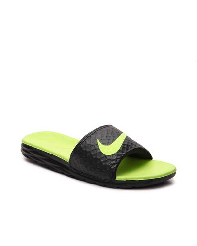 black and green nike slides