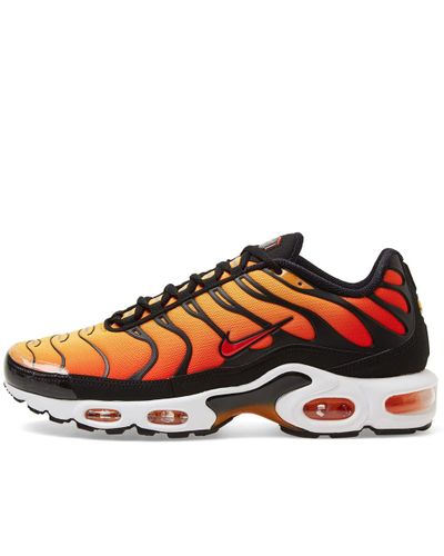 orange and yellow air max plus