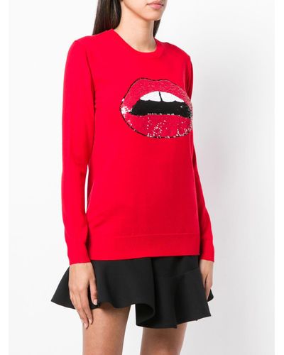 red jumper with sequin lips