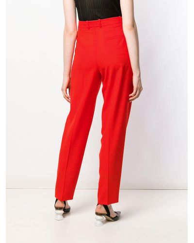 Givenchy Wool Pleated High-rise Trousers in Red - Lyst