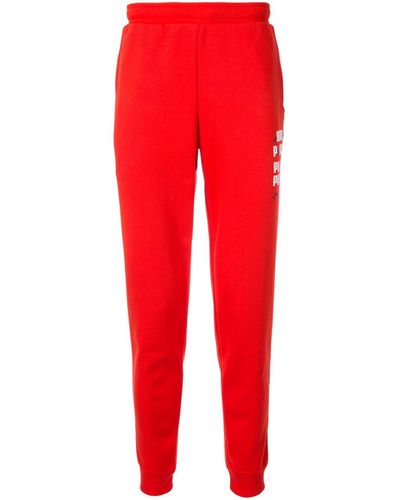 red puma track pants