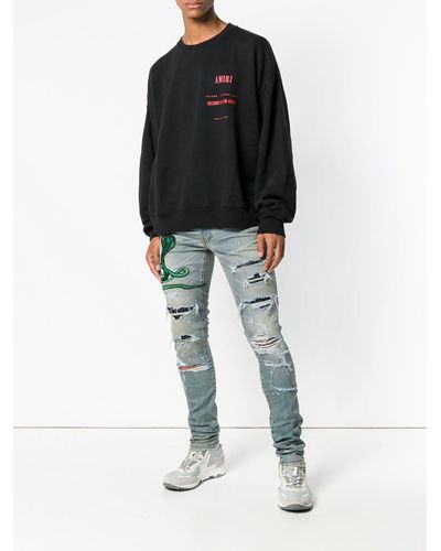 Jeans con strappi decorativi con applicazione serpenteAmiri in Denim da Uomo  colore Blu | Lyst