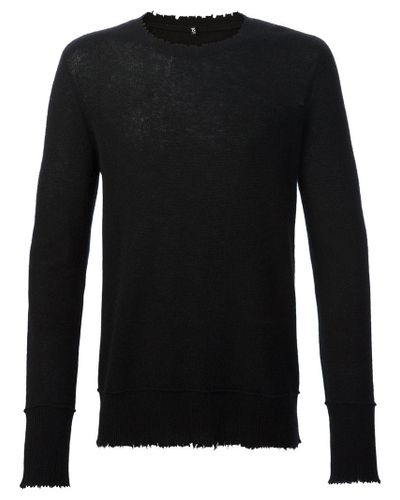 frayed black sweater