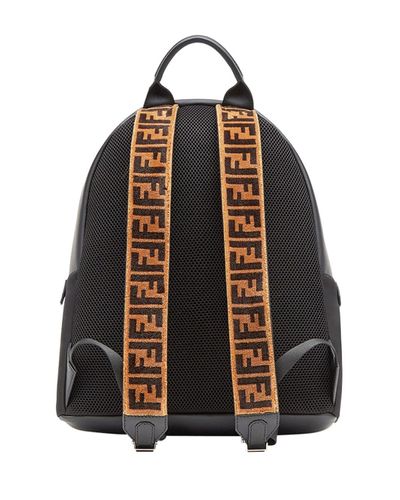 black backpack with brown straps