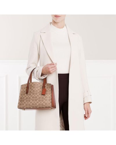 coach charlie carryall 28 in signature leather