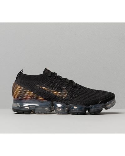 gray and orange vapormax flyknit