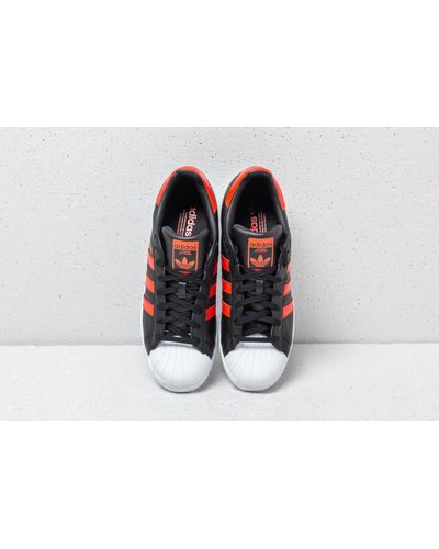 adidas superstar black and orange