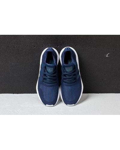 navy adidas swift run