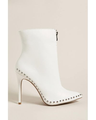 studded white booties