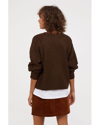 dark brown cable knit sweater