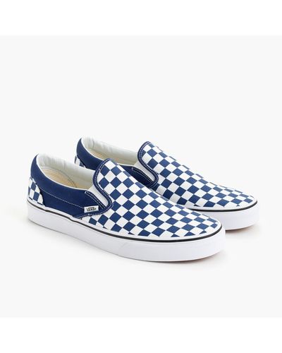 vans blue checkerboard slip ons