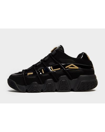 fila black and gold sneakers
