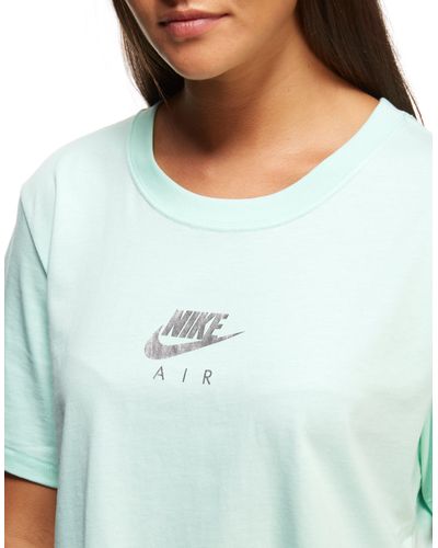 mint green nike shirt