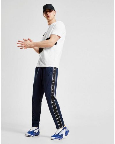 nike tape poly track pants