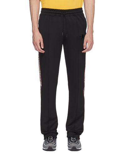 Daily Paper Synthetic 'liba' Logo Tape Outseam Pintucked Track Pants in  Black for Men - Lyst