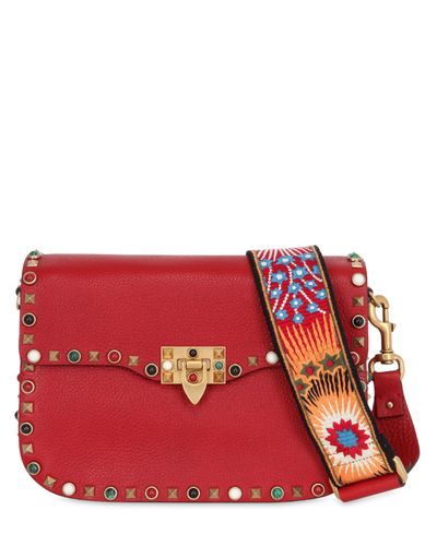 Valentino Suede Guitar Rockstud Rolling Cross Body Bag in Red | Lyst