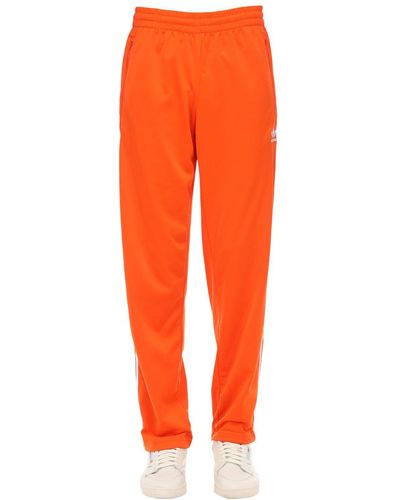 orange adidas trousers
