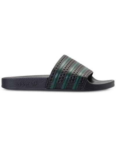 adidas Synthetic Adilette Slide Sandals From Finish Line in Black - Lyst