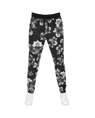 Nike Synthetic Floral Print Jogging Bottoms Black for Men | Lyst UK