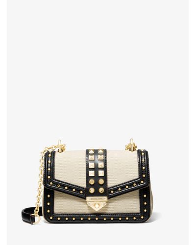 soho small studded leather and canvas shoulder bag