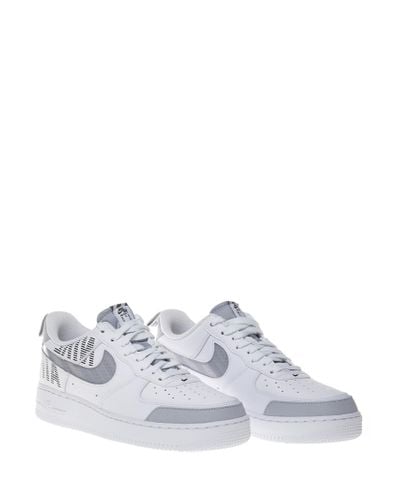 Sneakers bianche Air Force 1 '07 LV8 con swoosh riflettenti e ... Sneakers bianche Air Force 1 '07 LV8 con swoosh riflettenti e ...