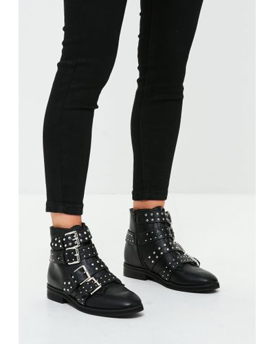 black studded strap ankle boots