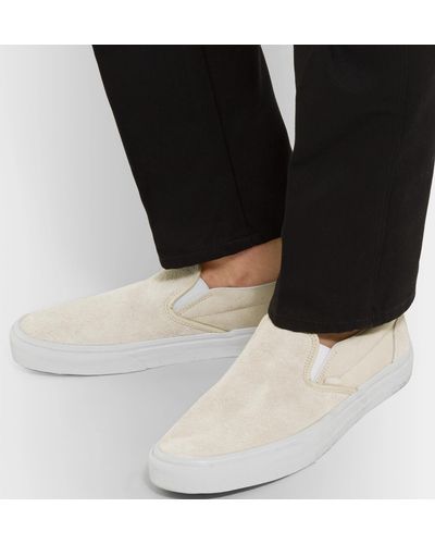 beige suede slip on vans