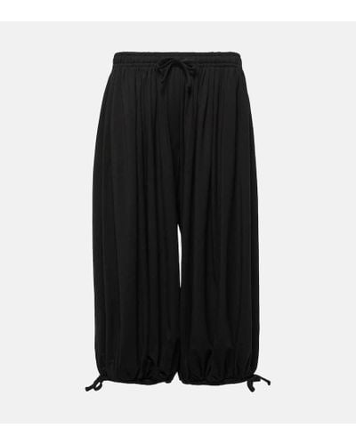 Totême Pantalones tapered de jersey fruncidos - Negro