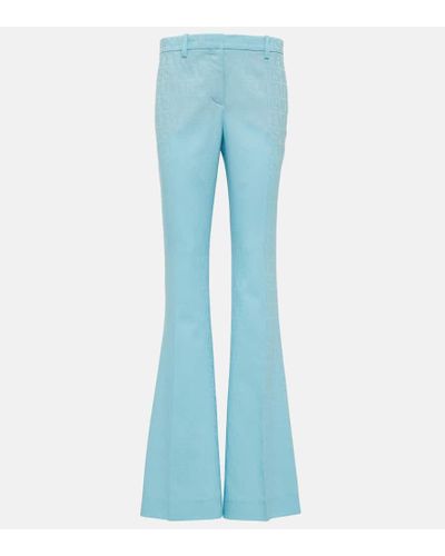 Versace Pantalones flared de lana con Allover - Azul