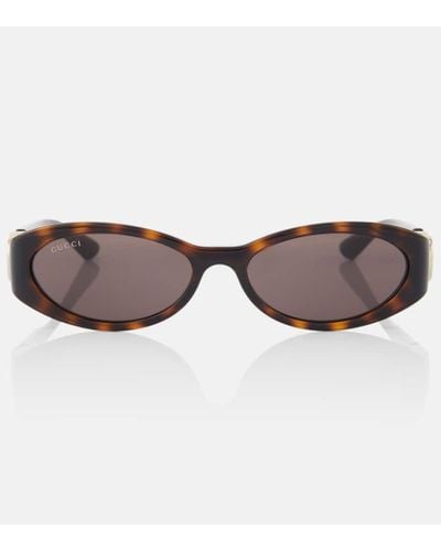 Gucci Gafas de sol ovaladas con GG - Marrón