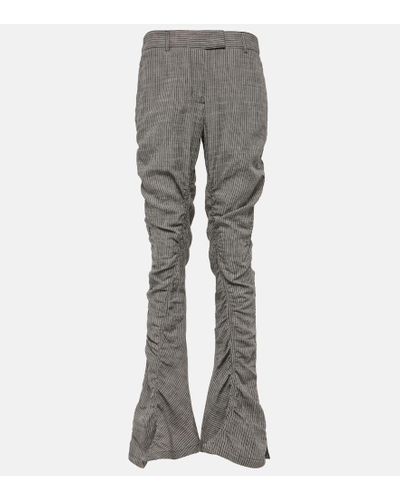 Acne Studios Pantaloni flared Paija con stampa - Grigio