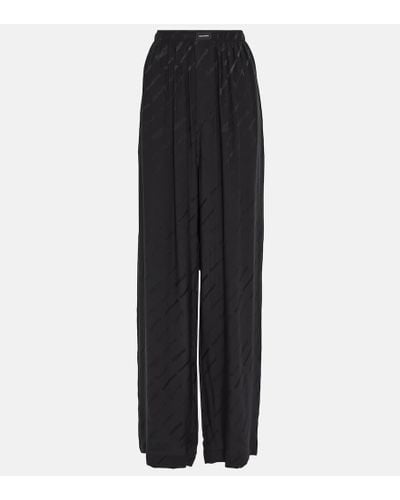 Balenciaga Pantalones anchos de tiro alto en seda - Negro