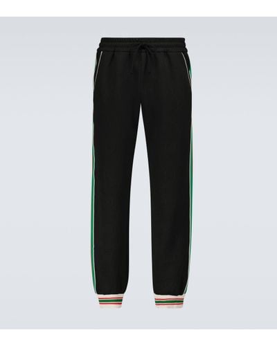 Gucci Pantalon de jogging en jersey à bandes Web - Noir