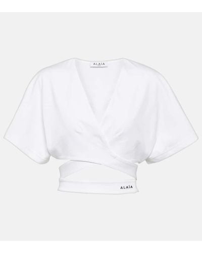 Alaïa Top cropped in jersey di cotone con logo - Bianco
