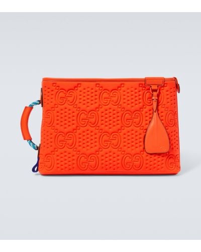 Gucci Large Embossed GG Leather-trimmed Pouch - Red