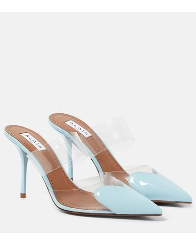 Alaïa Mules Cour en PVC et cuir verni - Blanc