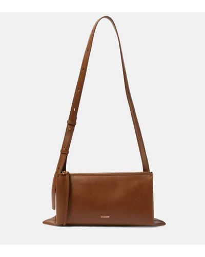 Jil Sander 'journal' Small Leather Foldover Shoulder Bag Women Bags  Shoulder Bags 'journal' Small Leather Foldover Shoulder Bag in Brown