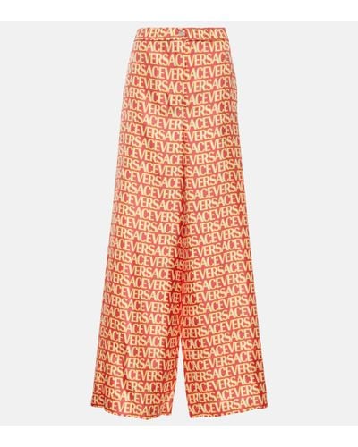 Versace Pantalon ample Allover en soie - Orange